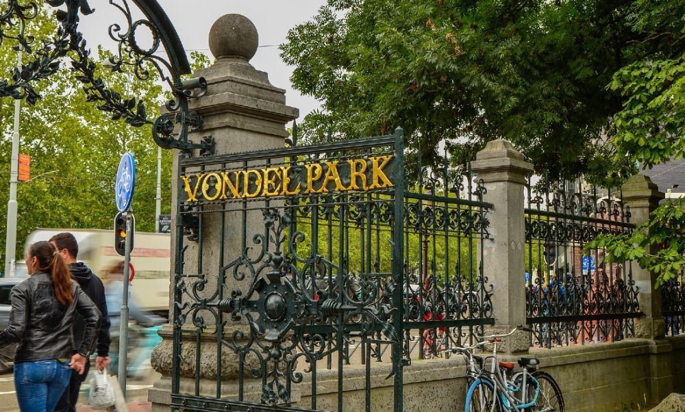 Romantic Proposal in Vondelpark Amsterdam Couple proposal in hidden garden corner of Vondelpark Amsterdam
