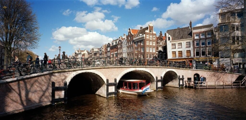 Torensluis stone bridge with canal houses in Amsterdam