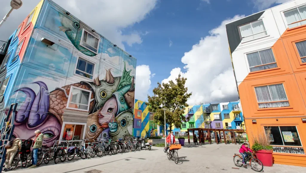  Colorful street art murals in narrow canal alleys Amsterdam