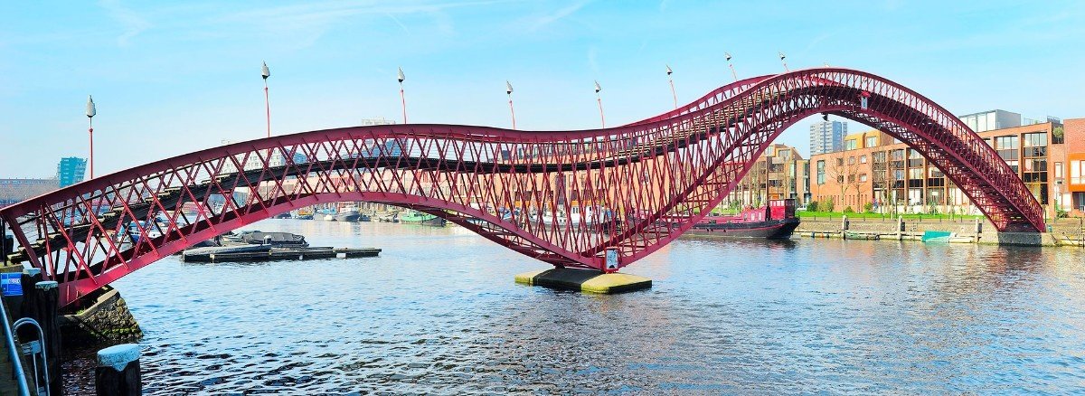 Python Bridge red twisting pedestrian bridge in Amsterdam