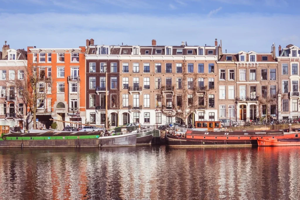 Amstel River with boats and canal views in Amsterdam