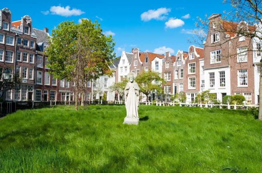  Begijnhof courtyard with historic canal houses in Amsterdam